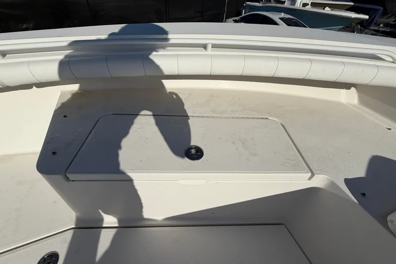 Slide: The Image of Open storage compartment on 2013 Regulator 24 Forward Seating boat. - 58