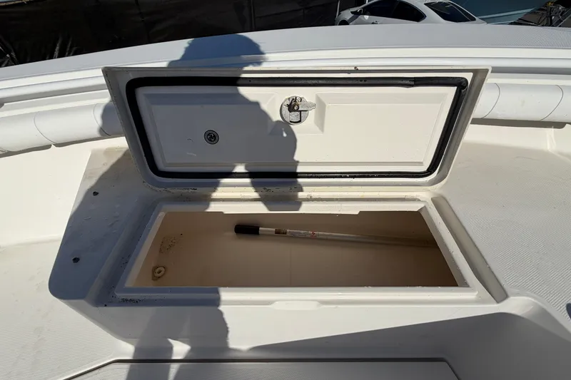 Slide: The Image of Open storage compartment on 2013 Regulator 24 Forward Seating boat. - 59