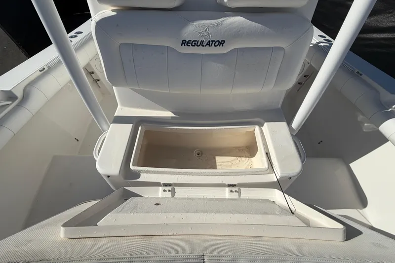 Slide: The Image of Open storage compartment on a 2013 Regulator 24 Forward Seating boat. - 75