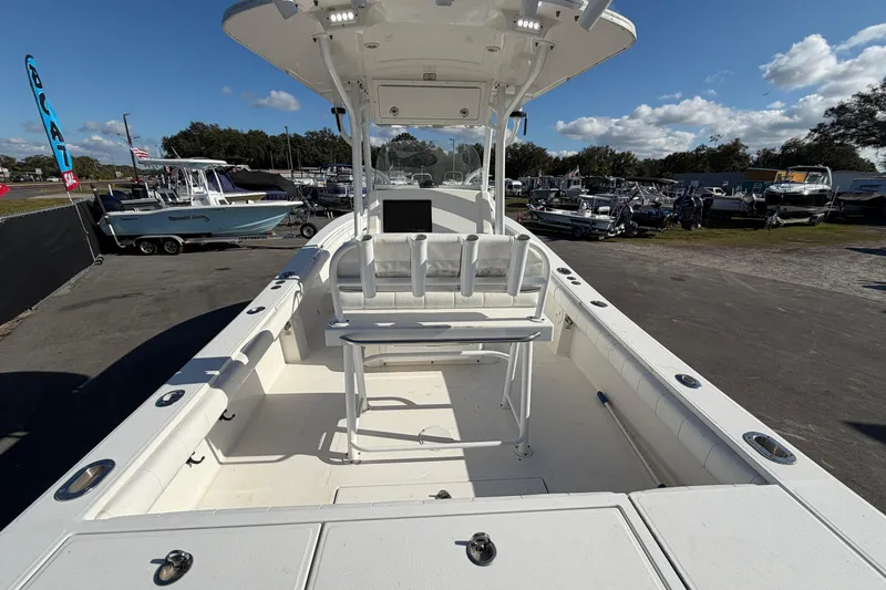 Slide: The Image of 2013 Regulator 24 Forward Seating boat with Yamaha outboard motor in a sunny setting. - 8