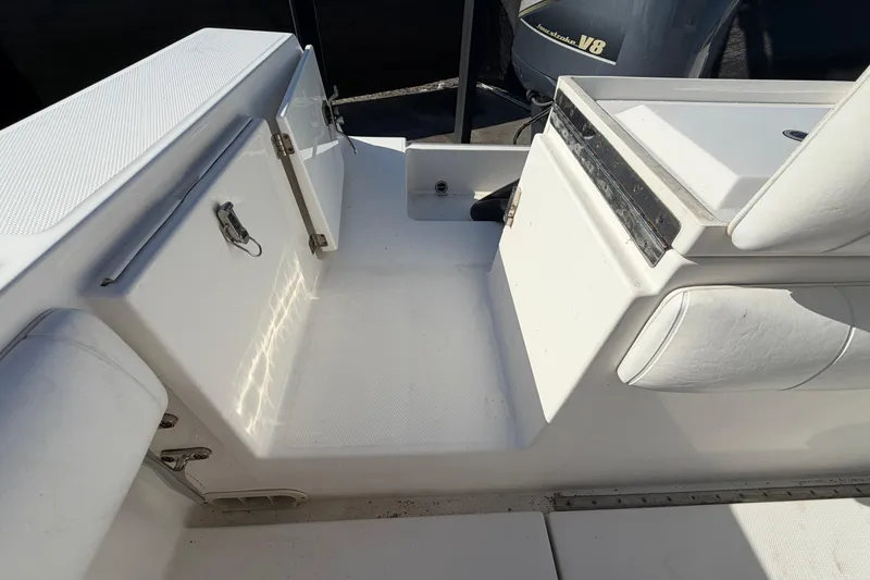 Slide: The Image of 2013 Regulator 24 Forward Seating boat deck with storage compartment. - 83