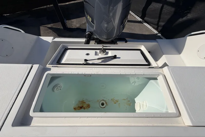 Slide: The Image of 2013 Regulator 24 Forward Seating boat deck with engine detail. - 87