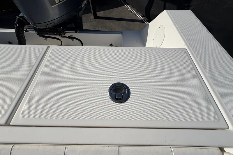 Slide: The Image of Open storage compartment on 2013 Regulator 24 Forward Seating boat. - 88
