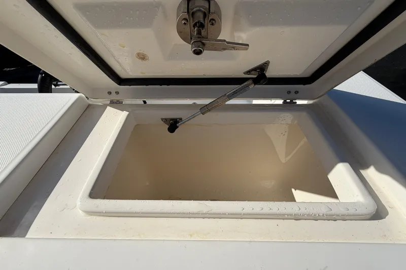 Slide: The Image of Livewell compartment in a 2013 Regulator 24 Forward Seating boat, open and empty. - 89