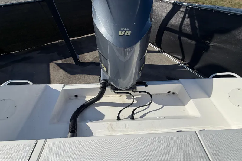 Slide: The Image of Trailer wheels of a 2013 Regulator 24 Forward Seating boat on pavement. - 91