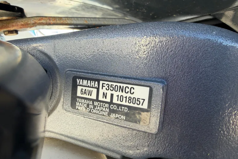 Slide: The Image of Trailer wheels of a 2013 Regulator 24 Forward Seating boat on asphalt. - 92