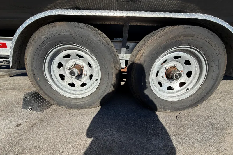 Slide: The Image of Trailer tire and loading information label for Regulator 24 Forward Seating, 2013 model. - 94