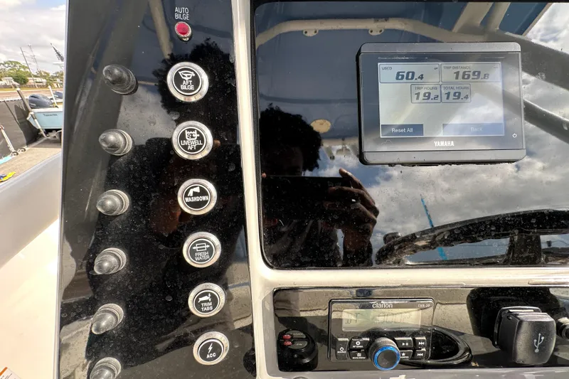 Slide: The Image of 2024 Robalo R232 Explorer dashboard with control buttons and Yamaha display. - 20