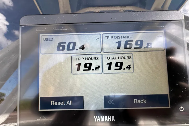 Slide: The Image of Yamaha display showing fuel usage, trip distance, and hours for 2024 Robalo R232 Explorer. - 21