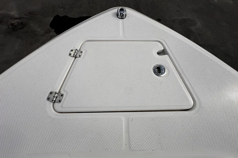 Slide: The Image of Robalo R232 Explorer 2024, boat deck with storage hatch. - 35