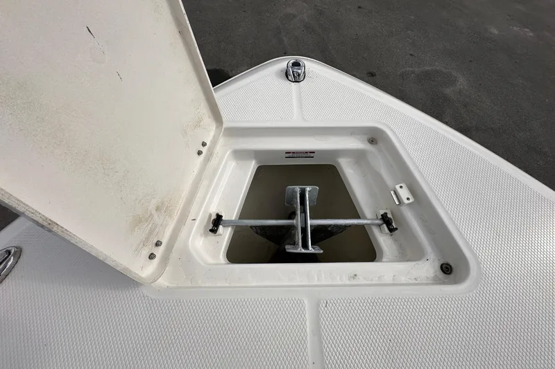 Slide: The Image of Anchor compartment of the 2024 Robalo R232 Explorer. - 36
