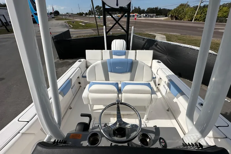 Slide: The Image of 2024 Robalo R232 Explorer boat interior with steering wheel and seating. - 42