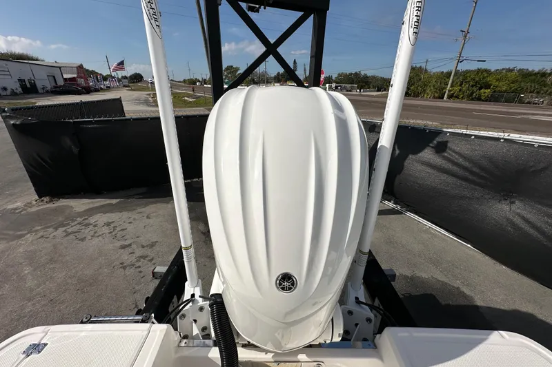 Slide: The Image of 2024 Robalo R232 Explorer boat engine with dual power poles, outdoor display. - 51