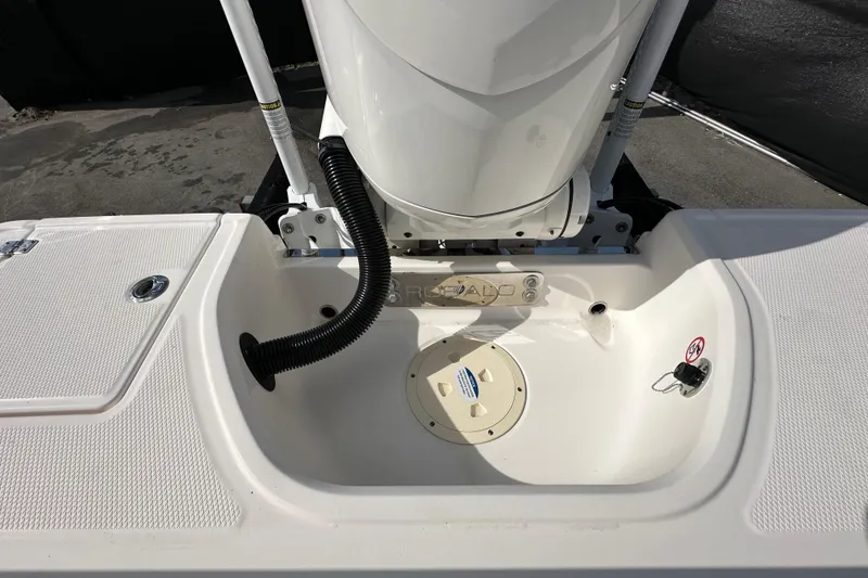 Slide: The Image of 2024 Robalo R232 Explorer with Yamaha outboard motor under a cloudy sky. - 52