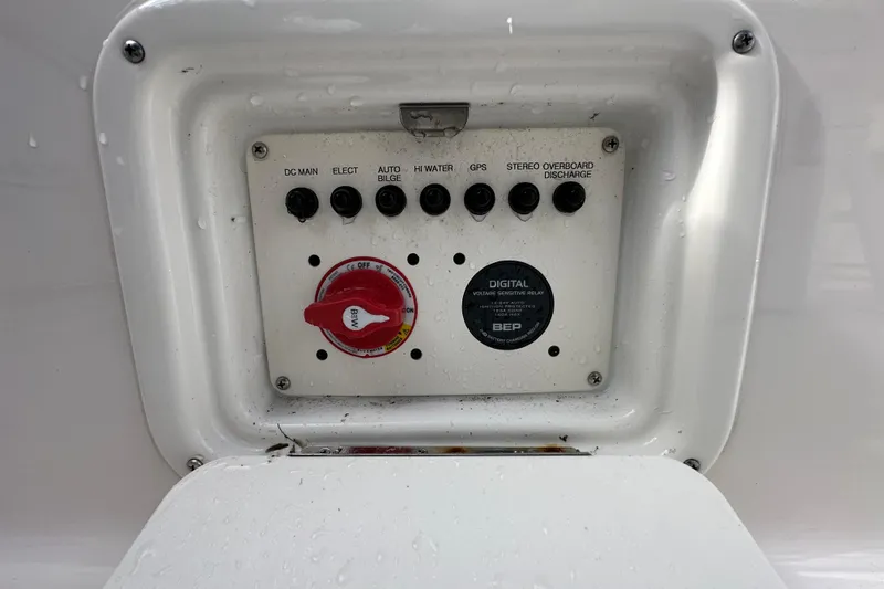 Slide: The Image of 2024 Robalo R232 Explorer boat with Yamaha engine, displayed outdoors under cloudy sky. - 53