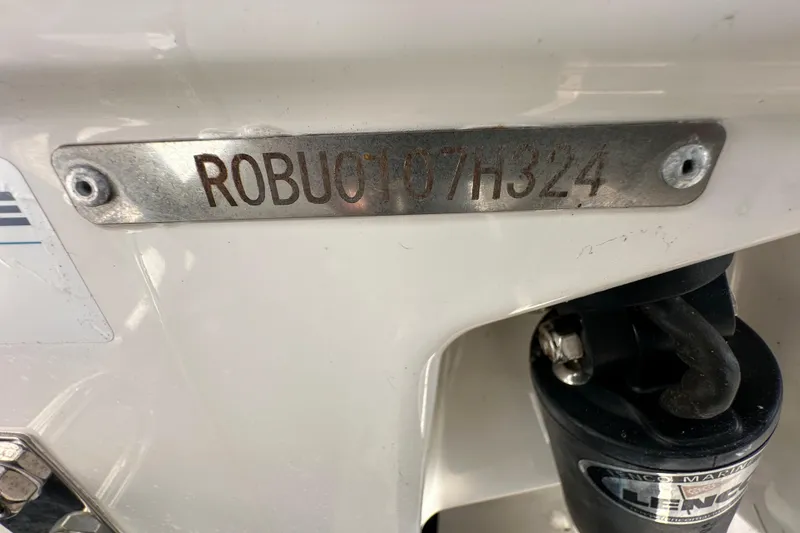 Slide: The Image of Control panel of 2024 Robalo R232 Explorer boat with switches and digital relay. - 55