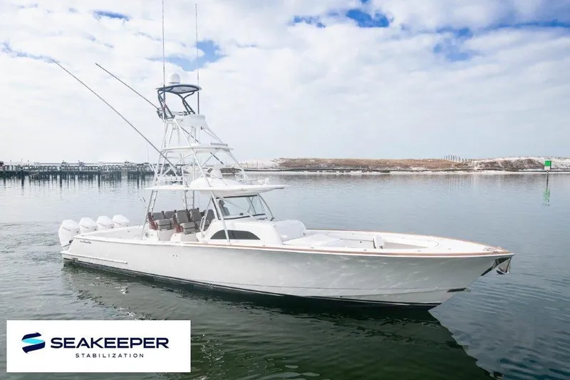 The Image of 2021 Valhalla Boatworks V-46 cruising on open water near a city skyline. - 0