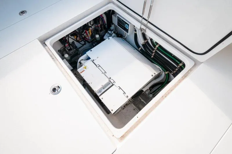 Slide: The Image of 2021 Valhalla Boatworks V-46 docked near waterfront homes, showcasing sleek design and luxury features. - 16