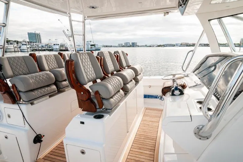 Slide: The Image of Valhalla Boatworks V-46, 2021 model, cruising at sunset on the ocean. - 2