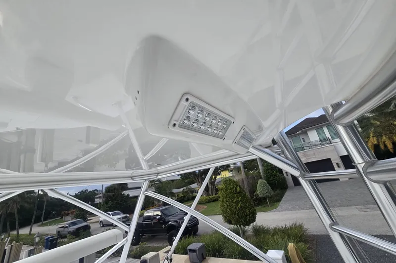 Slide: The Image of Four Mercury outboard engines on a 2021 Valhalla Boatworks V-46, docked on water. - 35