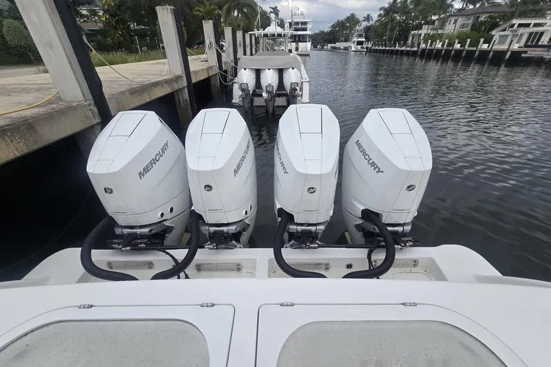 Slide: The Image of 2021 Valhalla Boatworks V-46 helm with steering wheel and controls, docked near water. - 40