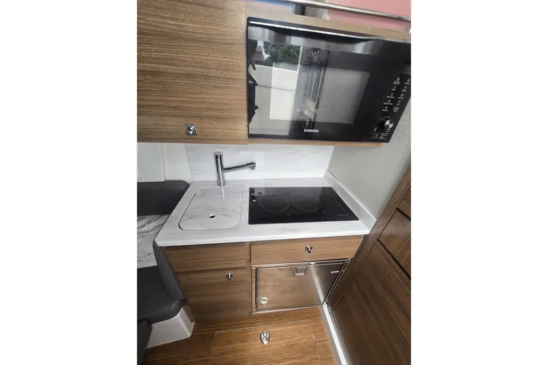 Slide: The Image of Control panel of 2021 Valhalla Boatworks V-46, featuring switches and keys. - 48