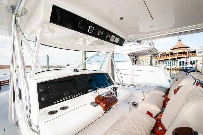 Slide: The Image of 2021 Valhalla Boatworks V-46 interior with luxurious seating and modern helm design. - 5