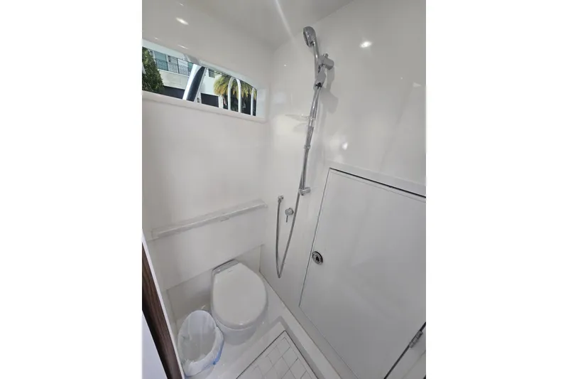 Slide: The Image of Control panel and wiring inside a 2021 Valhalla Boatworks V-46, featuring switches and fan. - 51