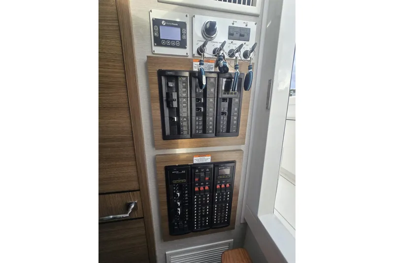 Slide: The Image of Engine room of 2021 Valhalla Boatworks V-46, featuring equipment and storage. - 53