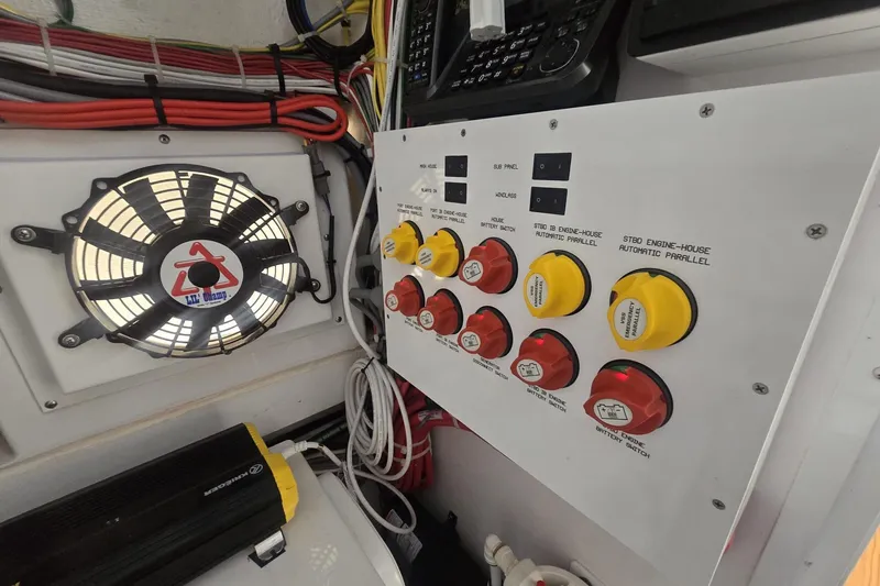 Slide: The Image of Engine compartment of 2021 Valhalla Boatworks V-46, showcasing wiring and components. - 56