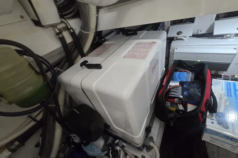 Slide: The Image of Open compartments of a 2021 Valhalla Boatworks V-46, showcasing internal equipment and wiring. - 57