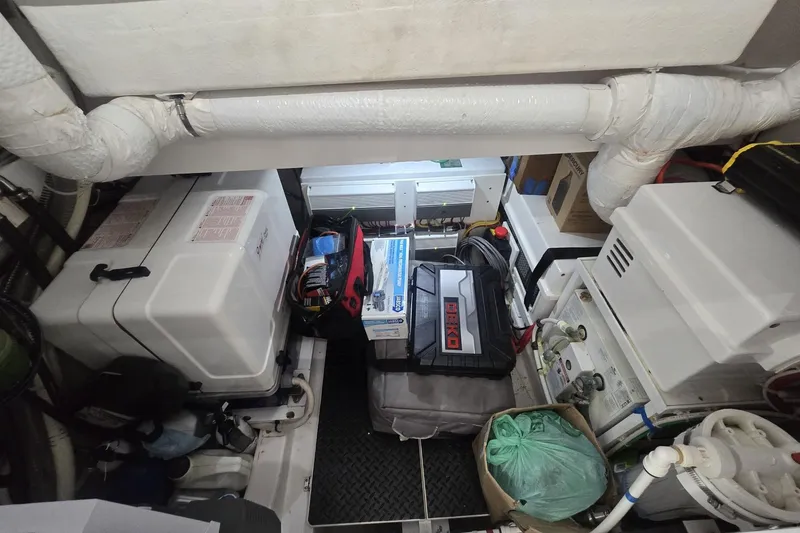 Slide: The Image of 2021 Valhalla Boatworks V-46 cruising in a marina, surrounded by other boats. - 58