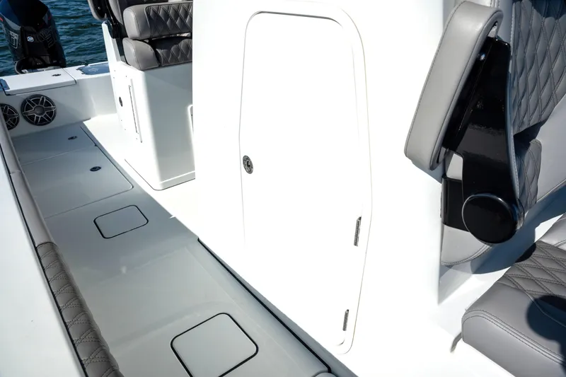 Slide: The Image of 2024 Freeman 28 boat interior with sleek seating and storage compartments. - 16