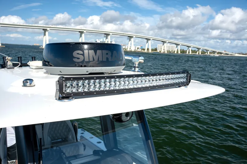 Slide: The Image of 2024 Freeman 28 boat with Simrad radar and Rigid light bar on water. - 20