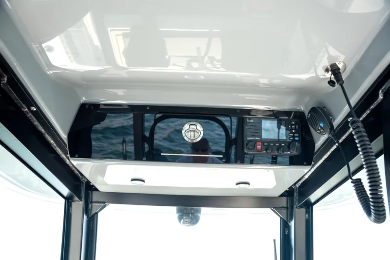 Slide: The Image of Interior view of 2024 Freeman 28 boat cockpit with communication equipment. - 23