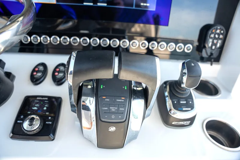 Slide: The Image of Control panel of 2024 Freeman 28 boat with advanced navigation and throttle systems. - 27