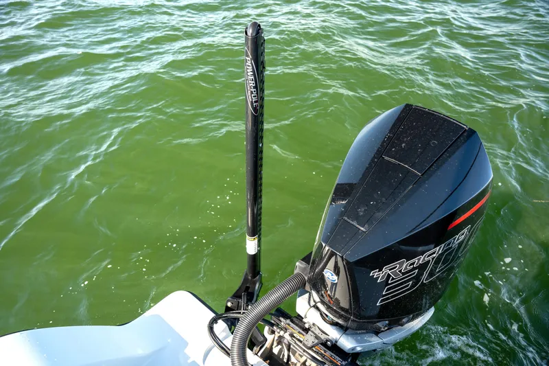 Slide: The Image of Freeman 28 boat with powerful outboard motor on green water, 2024 model. - 30