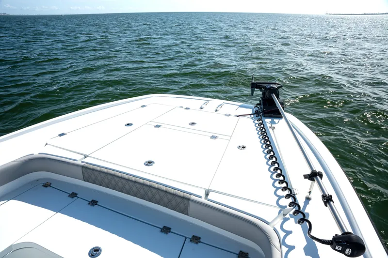 Slide: The Image of 2024 Freeman 28 boat deck on open water, featuring sleek design and modern equipment. - 36