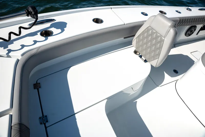 Slide: The Image of 2024 Freeman 28 boat interior with cushioned seating and sleek design. - 37