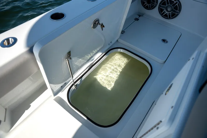 Slide: The Image of 2024 Freeman 28 boat interior with open storage compartment and speakers. - 7