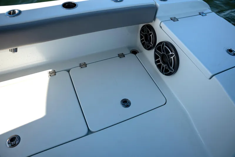 Slide: The Image of 2024 Freeman 28 boat deck with storage compartments and speakers. - 8