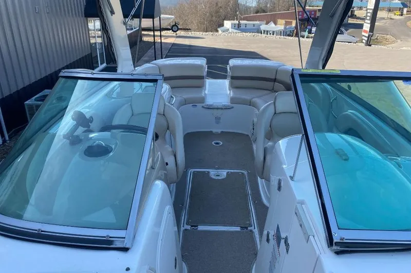 Slide: The Image of 2006 Chaparral 256 SSi boat interior with seating and windshield view. - 10