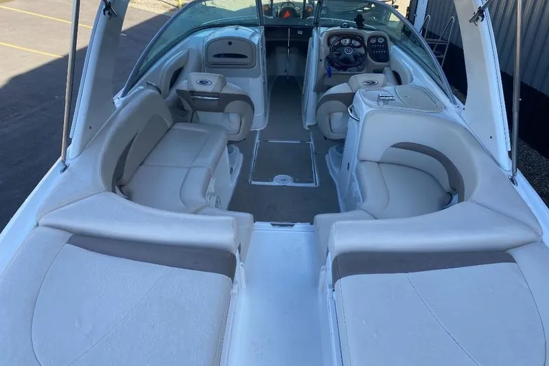 Slide: The Image of 2006 Chaparral 256 SSi boat interior with spacious seating and modern dashboard. - 4