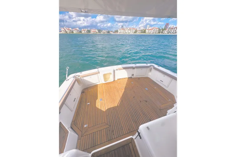 Slide: The Image of 1999 Wellcraft 400 Coastal boat deck with scenic waterfront view. - 19