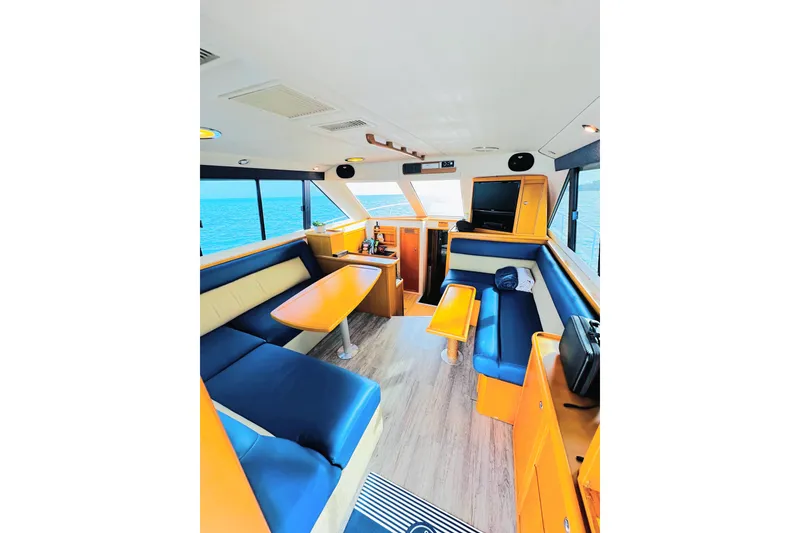 Slide: The Image of Interior of 1999 Wellcraft 400 Coastal yacht with modern seating and ocean view. - 2