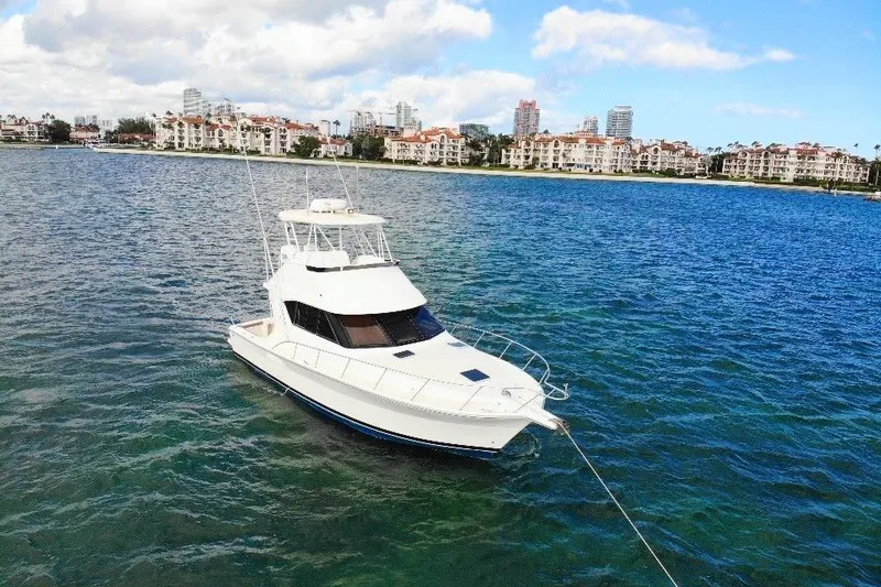 Slide: The Image of 1999 Wellcraft 400 Coastal yacht anchored in scenic coastal waters. - 20