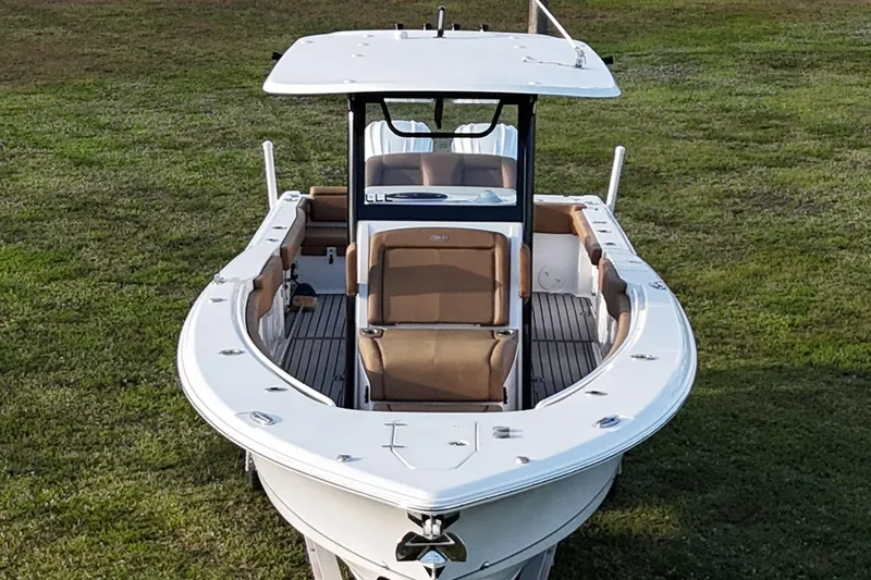 Slide: The Image of 2023 Seahunt 30 GameFish Coffin Box boat on grassy field, front view. - 12