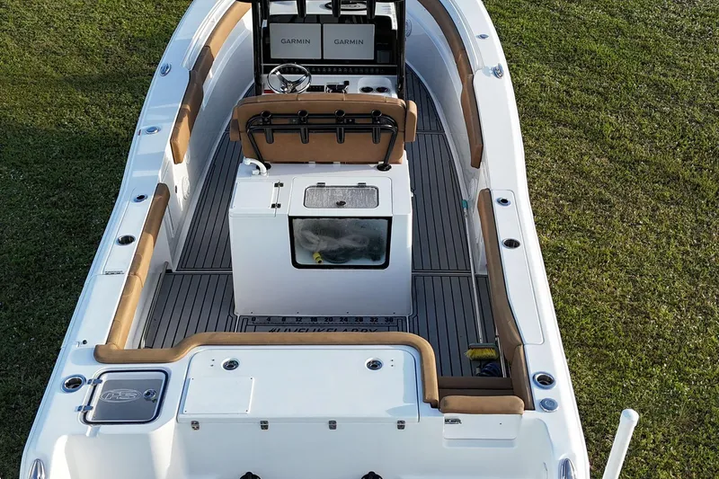 Slide: The Image of 2023 Seahunt 30 GameFish Coffin Box boat with spacious deck and modern controls. - 8