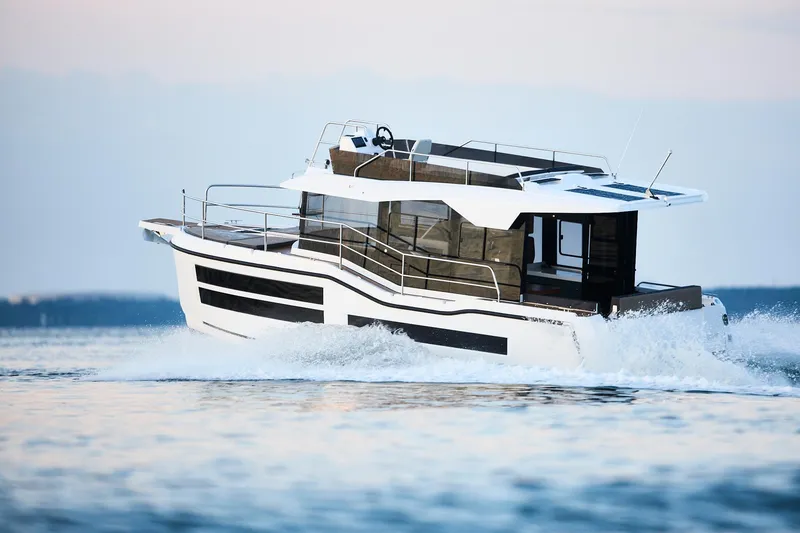 Slide: The Image of Modern Northman 1050 yacht cruising on open water, 2025 model. - 0