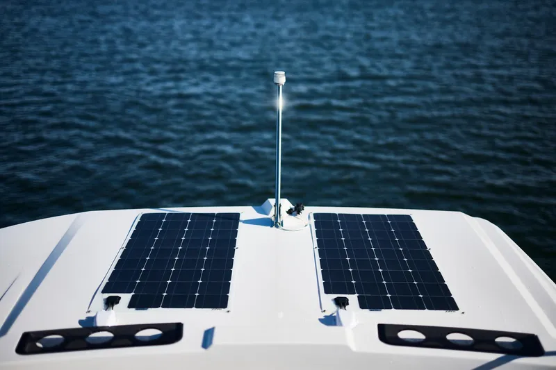 Slide: The Image of Solar panels on Northman 1050 boat, 2025 model, with ocean background. - 18